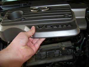 Removing nissan maxima engine cover #10